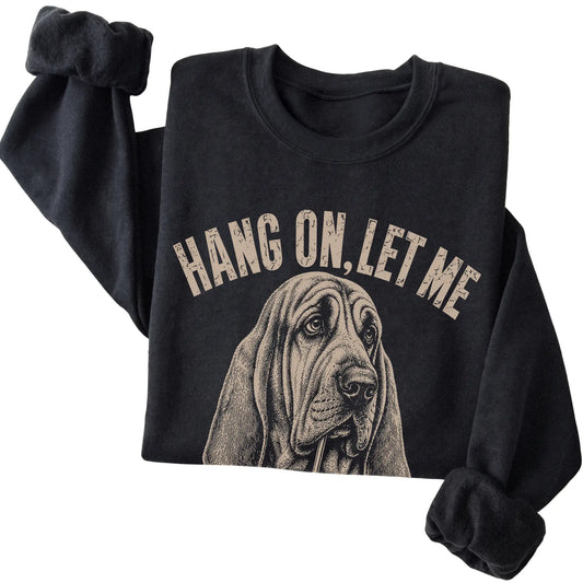 Black crewneck sweatshirt featuring Overthinking Bloodhound, folded presentation