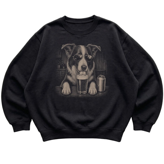 Black Border Collie drinking from a pint at a bar, laid flat
