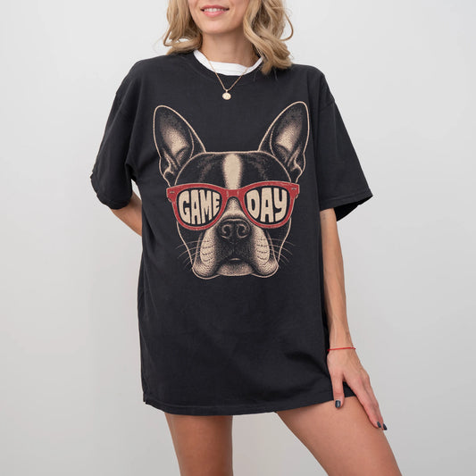Model wearing a Black Comfort Colors® T-shirt with boston terrier wearing red game day sunglasses