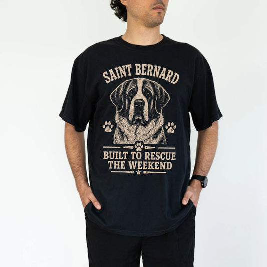 Model wearing a Black Comfort Colors® T-shirt featuring Saint Bernard design with “Built To Rescue The Weekend” lettering