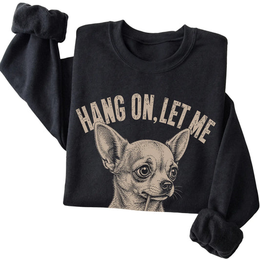 Black crewneck sweatshirt featuring Overthinking Chihuahua, folded presentation