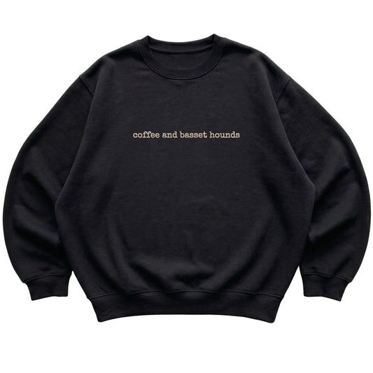 Black Coffee and Basset Hounds sweatshirt laid flat
