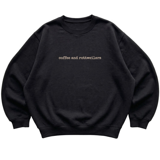 Black Coffee and Rottweilers sweatshirt laid flat