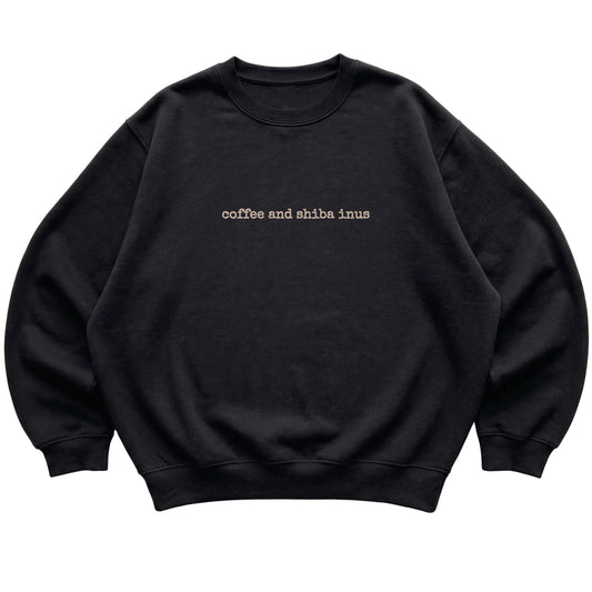 Black Coffee and Shiba Inus sweatshirt laid flat