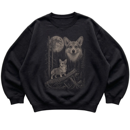 Corgi Moonlit Forest graphic on a black crewneck sweatshirt laid flat