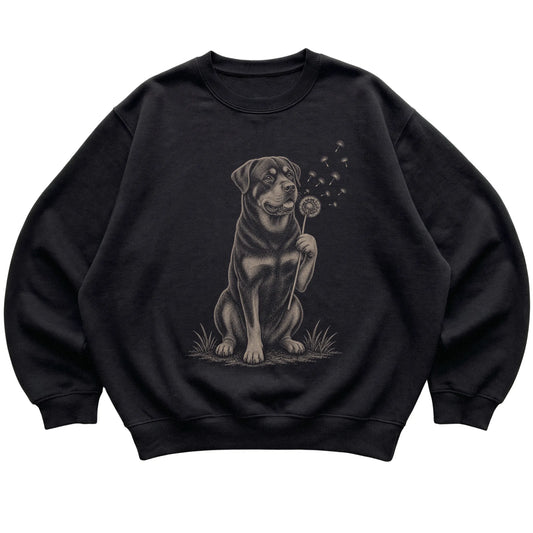 Black crewneck sweatshirt featuring Dandelion Rottweiler, laid-flat presentation