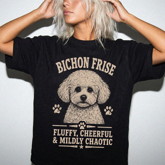 Model wearing a Black Comfort Colors® T-shirt featuring Bichon Frise personality design with “Fluffy, Cheerful & Mildly Chaot