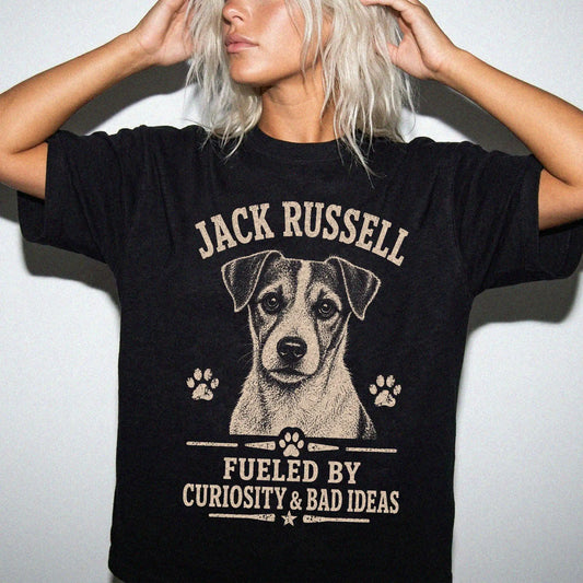 Model wearing a Black Comfort Colors® T-shirt featuring Jack Russell design with “Fueled By Curiosity & Bad Ideas” lettering