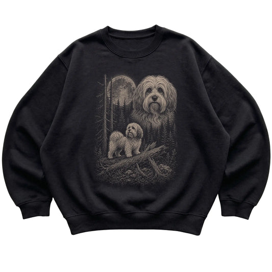 Havanese Moonlit Forest graphic on a black crewneck sweatshirt laid flat
