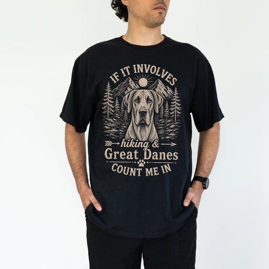 Model wearing a Black Comfort Colors® T-shirt featuring Great Dane hiking design with mountain scenery
