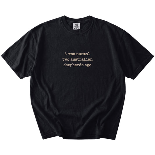 I Was Normal Two Australian Shepherds Ago lettering on a Black Comfort Colors® T-shirt