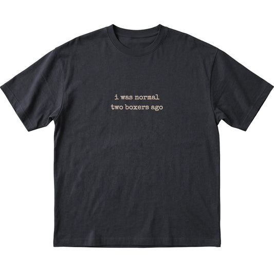 Black I Was Normal Two Boxers Ago T-shirt laid flat