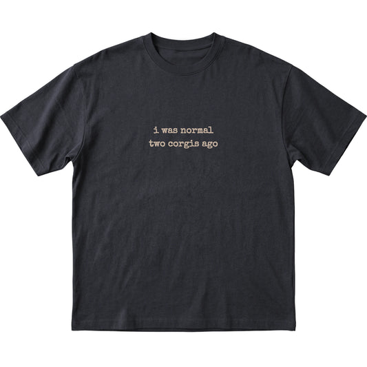 Black I Was Normal Two Corgis Ago T-shirt laid flat