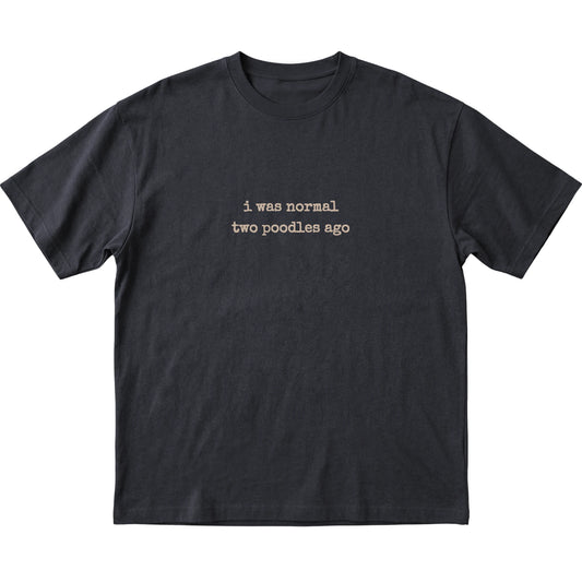 Black I Was Normal Two Poodles Ago T-shirt laid flat