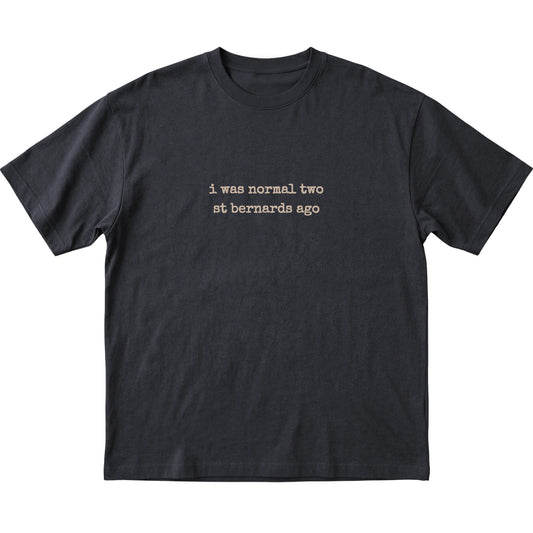 Black I Was Normal Two St Bernards Ago T-shirt laid flat