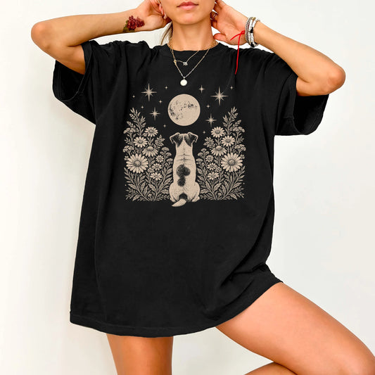 Model wearing a Black Comfort Colors® T-shirt featuring Jack Russell beneath a wildflower moon