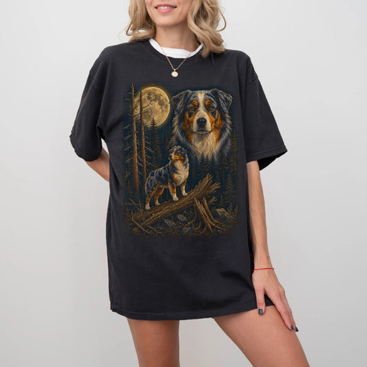 Person wearing a Black Australian Shepherd full-color Moonlit Forest t-shirt