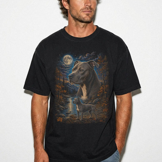 Model wearing a Black Comfort Colors® t-shirt featuring Pitbull in a moonlit fall forest