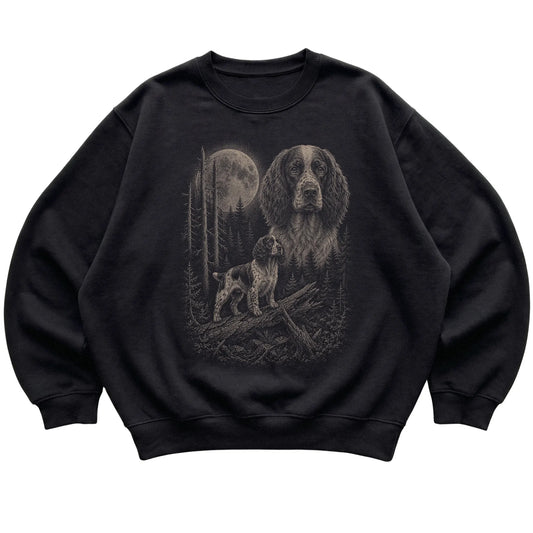 Springer Spaniel Moonlit Forest graphic on a black crewneck sweatshirt laid flat