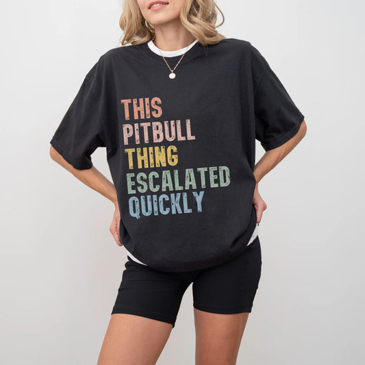 Model wearing a Black Comfort Colors® T-shirt with retro “This Pitbull Thing Escalated Quickly” lettering