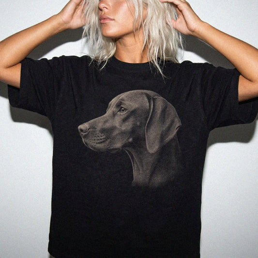 Model wearing a Black Comfort Colors® T-shirt with a detailed photographic portrait of a Vizsla