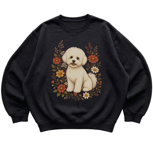 Black crewneck sweatshirt with Bichon Frise portrait and wildflowers, flat lay