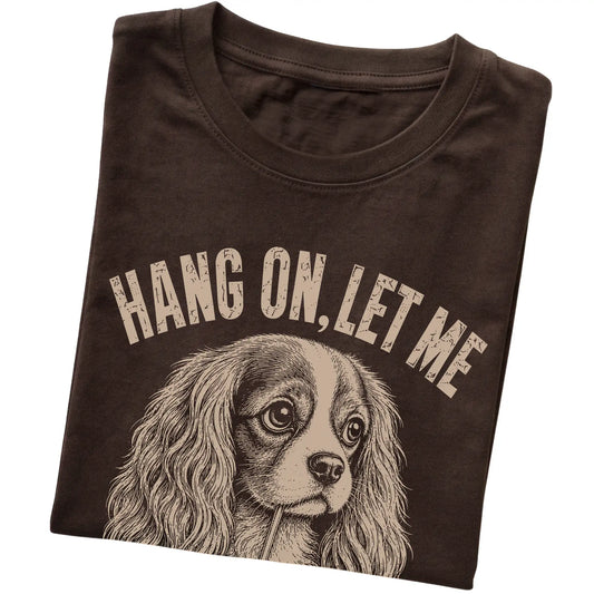 Dark Chocolate T-shirt featuring Overthinking Cavalier King Charles Spaniel, folded presentation