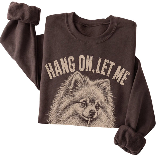 Dark Chocolate crewneck sweatshirt featuring Overthinking Pomeranian, folded presentation