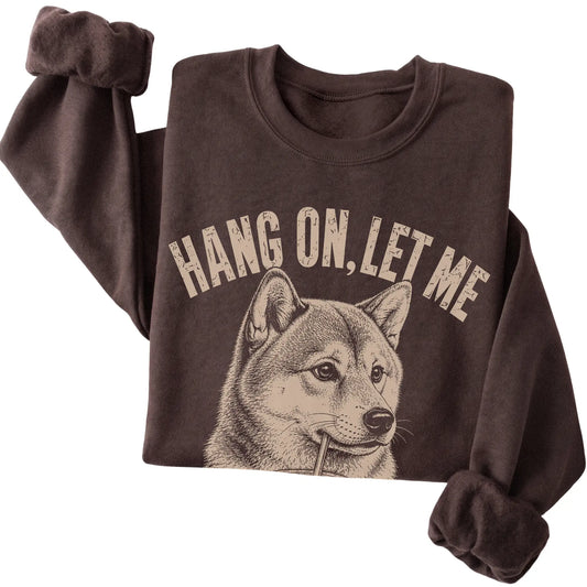 Dark Chocolate crewneck sweatshirt featuring Overthinking Shiba Inu, folded presentation