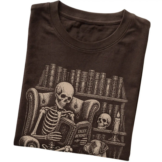 Folded Dark Chocolate T-shirt with a skeleton reading Tales Beyond to a Boxer