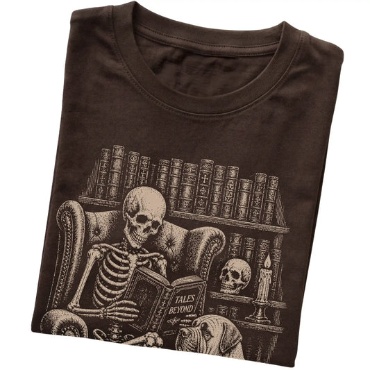 Folded Dark Chocolate T-shirt with a skeleton reading Tales Beyond to a Mastiff