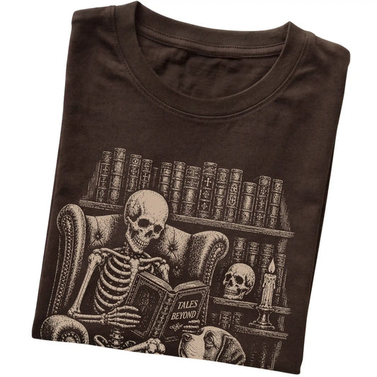 Folded Dark Chocolate T-shirt with a skeleton reading Tales Beyond to a Saint Bernard