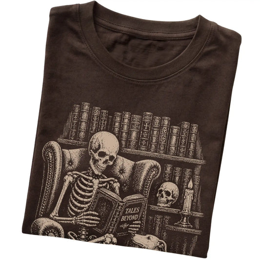 Folded Dark Chocolate T-shirt with a skeleton reading Tales Beyond to a Whippet