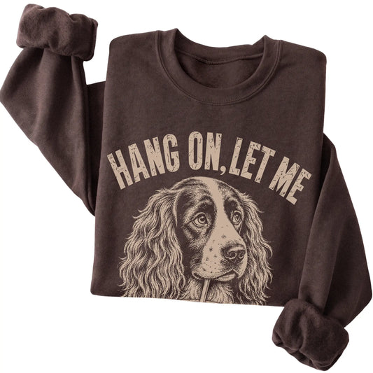 Dark Chocolate crewneck sweatshirt featuring Overthinking Springer Spaniel, folded presentation