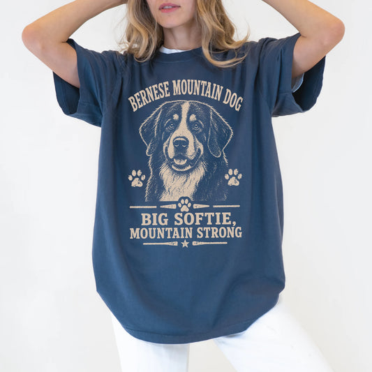 Model wearing a Denim Comfort Colors® T-shirt featuring Bernese Mountain Dog design with “Big Softie, Mountain Strong” letter