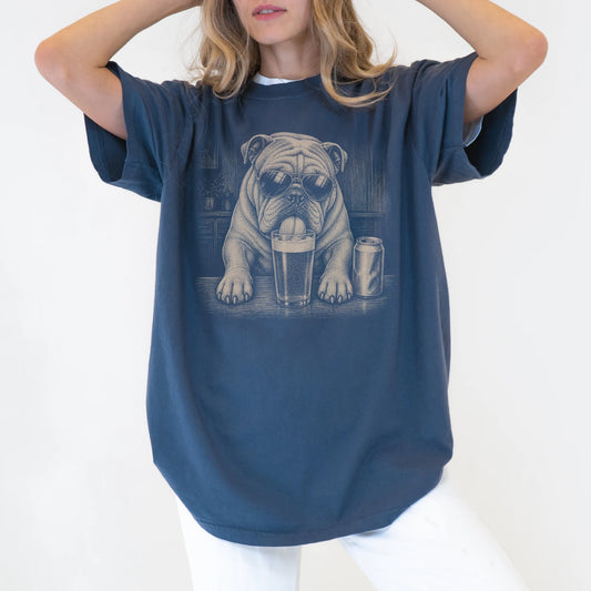 Model wearing a Denim Comfort Colors® t-shirt with Bulldog sneaking a drink from a pint