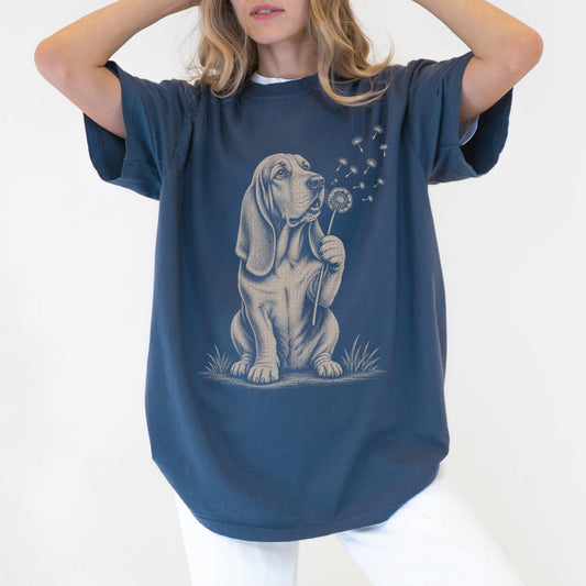 Model wearing a Denim Comfort Colors® T-shirt showing Basset Hound portrait with drifting dandelion seeds