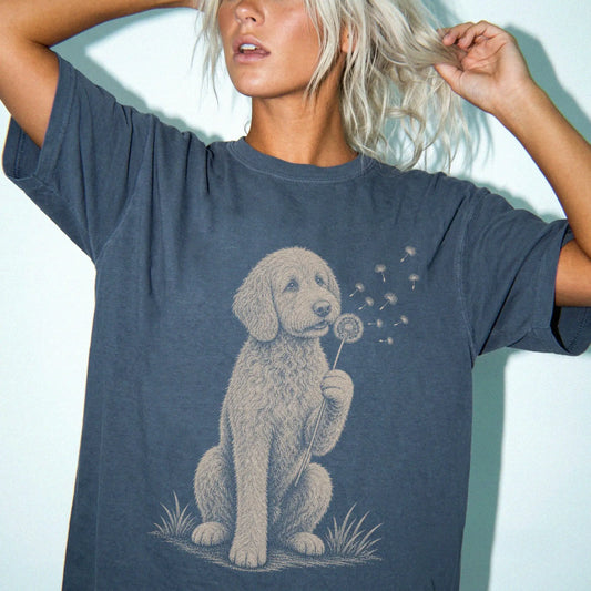 Model wearing a Denim Comfort Colors® T-shirt showing Labradoodle portrait with drifting dandelion seeds
