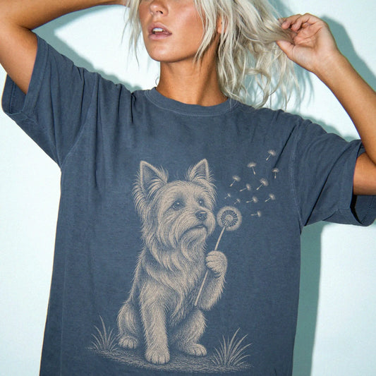 Model wearing a Denim Comfort Colors® T-shirt showing Yorkie portrait with drifting dandelion seeds