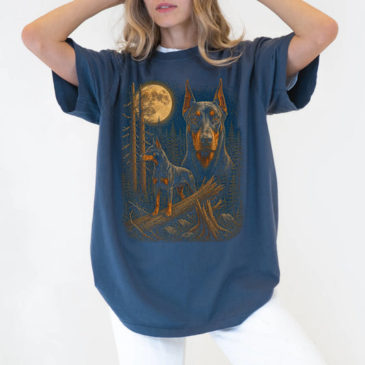 Person wearing a Denim Doberman Wildwood Moon t-shirt