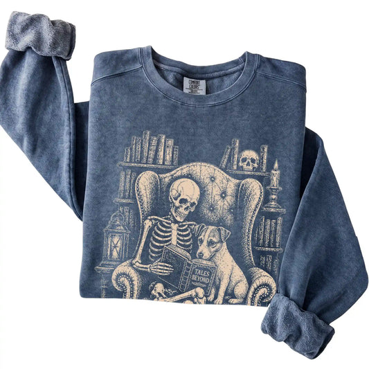 Folded Denim sweatshirt with a skeleton reading Tales Beyond to a Jack Russell