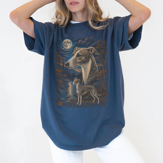 Model wearing a denim T-shirt with Whippet Autumn Moon artwork.