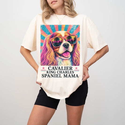 Retro Cavalier King Charles Spaniel Mama design on a Ivory Comfort Colors T-shirt worn by a model
