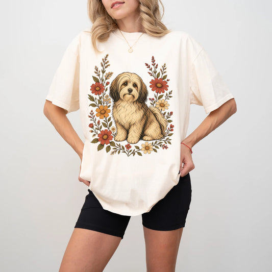 Model wearing an Ivory Comfort Colors® T-shirt showing Havanese portrait surrounded by wildflowers beneath the moon