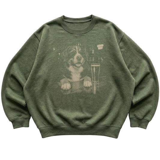 Military Green Bernese Mountain Dog at a bar beside a pint, laid flat