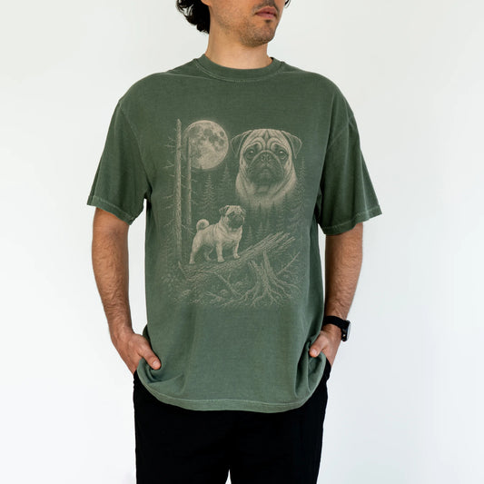 Man wearing a Moss Pug Moonlit Forest T-Shirt
