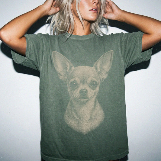 Model wearing a Moss Comfort Colors® T-shirt with a realistic drawing of a Chihuahua