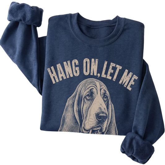Navy crewneck sweatshirt featuring Overthinking Basset Hound, folded presentation