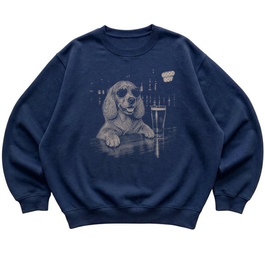 Navy Springer Spaniel at a bar beside a pint, laid flat