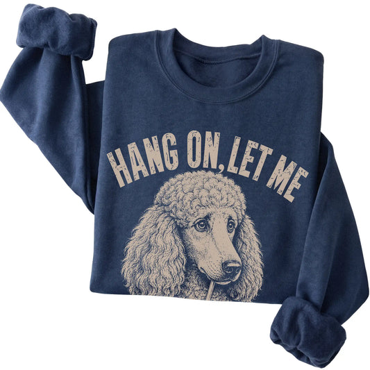 Navy crewneck sweatshirt featuring Overthinking Poodle, folded presentation